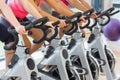 Mid section of people working out at spinning class Royalty Free Stock Photo