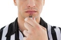 Mid section of referee blowing whistle Royalty Free Stock Photo