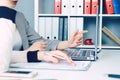 Mid section of two business women sitting together and working on laptop. Executives meeting in a office lobby. Woman Royalty Free Stock Photo