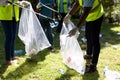 Mid section view of a multi-generation mixed race family collecting garbage Royalty Free Stock Photo