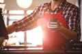 Mid section of waiter showing credit card machine