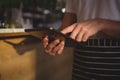 Mid section of waiter using tablet by counter