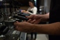 Mid section of waiter working at counter