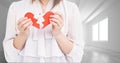 Mid section of woman holding a broken heart Royalty Free Stock Photo