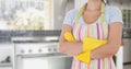 Mid section of woman standing with arms crossed standing in kitchen Royalty Free Stock Photo