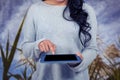 Mid section of woman using digital tablet against field Royalty Free Stock Photo