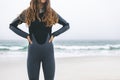 Woman standing with hands on hip on beach Royalty Free Stock Photo