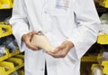 Mid section of a young technician holding artificial foot Royalty Free Stock Photo