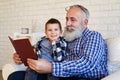 A mid shot of cute grandpa and his grandchild