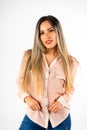 A mid-shot with vertical orientation of a beautiful smiling Latina woman with her hands forward and looking straight ahead on a Royalty Free Stock Photo