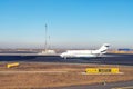 Mid size modern vip private jet running on rairport runway ready to departure. Pilot asking air traffic control officer for take- Royalty Free Stock Photo