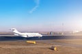 Mid size modern vip private jet running on rairport runway ready to departure. Pilot asking air traffic control officer for take- Royalty Free Stock Photo