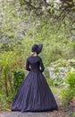 Victorian woman in summer garden