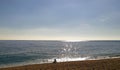 Midday, few clouds , beach , waves , sand , lonely woman