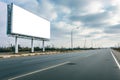 Midday View of White Billboard on Freeway.