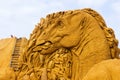 Middelkerke, Belgium - 23 July 2022: An art portrait of a herbivore dinosaur sand sculpture in Middelkerke, Belgium. The