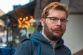 Middle adult bearded man portrait street outdoor person face photography with unfocused background view golden bokeh illumination