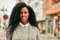 Middle age african american businesswoman smiling happy standing at the city Royalty Free Stock Photo