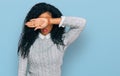 Middle age african american woman wearing casual clothes covering eyes with arm, looking serious and sad Royalty Free Stock Photo