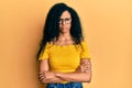 Middle age african american woman wearing casual clothes and glasses relaxed with serious expression on face Royalty Free Stock Photo