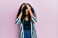 Middle age african american woman wearing casual clothes suffering from headache desperate and stressed because pain and migraine Royalty Free Stock Photo