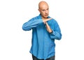 Middle age bald man wearing casual clothes doing time out gesture with hands, frustrated and serious face Royalty Free Stock Photo