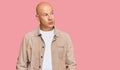 Middle age bald man wearing casual clothes smiling looking to the side and staring away thinking Royalty Free Stock Photo