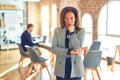 Middle age beautiful businesswoman wearing jacket and glasses standing at the office thinking looking tired and bored with Royalty Free Stock Photo