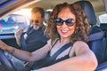 Middle age beautiful couple on vacation wearing sunglasses smiling happy driving car Royalty Free Stock Photo