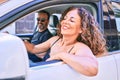 Middle age beautiful couple on vacation wearing sunglasses smiling happy driving car Royalty Free Stock Photo