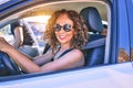 Middle age beautiful couple on vacation wearing sunglasses smiling happy driving car Royalty Free Stock Photo