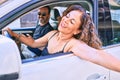 Middle age beautiful couple on vacation wearing sunglasses smiling happy driving car Royalty Free Stock Photo