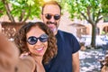Middle age beautiful couple wearing casual clothes and sunglasses smiling happy Royalty Free Stock Photo
