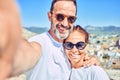 Middle age beautiful couple wearing casual clothes and sunglasses smiling happy Royalty Free Stock Photo