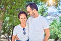 Middle age beautiful couple wearing casual clothes and sunglasses smiling happy Royalty Free Stock Photo