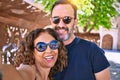 Middle age beautiful couple wearing casual clothes and sunglasses smiling happy Royalty Free Stock Photo