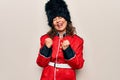 Middle age beautiful wales guard woman wearing traditional uniform over white background celebrating surprised and amazed for Royalty Free Stock Photo