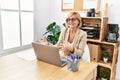 Middle age blonde woman smiling confident having video call at office Royalty Free Stock Photo