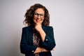 Middle age brunette business woman wearing glasses standing over isolated white background looking confident at the camera smiling Royalty Free Stock Photo