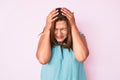 Middle age brunette hispanic woman wearing casual clothes suffering from headache desperate and stressed because pain and migraine Royalty Free Stock Photo