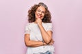 Middle age brunette woman wearing cute princess crown tiara over pink background smiling looking confident at the camera with