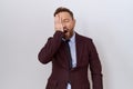 Middle age business man with beard wearing suit and tie yawning tired covering half face, eye and mouth with hand Royalty Free Stock Photo
