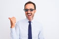 Middle age businessman wearing thug life sunglasses over isolated white background smiling with happy face looking and pointing to Royalty Free Stock Photo