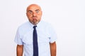 Middle age businessman wearing tie standing over isolated white background puffing cheeks with funny face