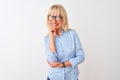 Middle age businesswoman wearing elegant shirt and glasses over isolated white background looking confident at the camera smiling Royalty Free Stock Photo