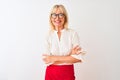 Middle age businesswoman wearing shirt and glasses standing over isolated white background happy face smiling with crossed arms Royalty Free Stock Photo
