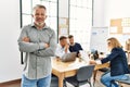 Middle age caucasian businessman smiling happy standing with arms crossed gesture at the office during business meeting Royalty Free Stock Photo