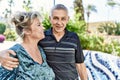 Middle age caucasian couple of husband and wife together on a sunny day outdoors Royalty Free Stock Photo