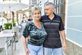 Middle age caucasian couple of husband and wife together on a sunny day outdoors Royalty Free Stock Photo