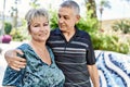 Middle age caucasian couple of husband and wife together on a sunny day outdoors Royalty Free Stock Photo